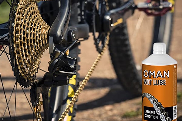 Sisbrill Oman Wet Lube lubricante con cadena de bicicleta de fondo